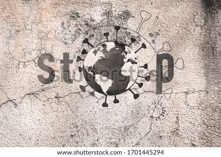 Stop Covid-19 pandemic planet earth concept.Textured wall background . Royalty-Free Stock Photo #1701445294