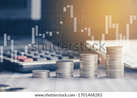 Stack of money coin with trading graph, financial investment concept can be use as background Royalty-Free Stock Photo #1701468283