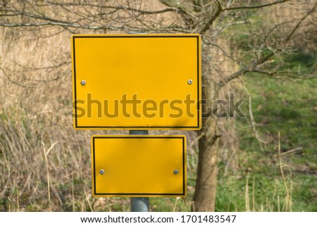 Blank yellow board giving warning message