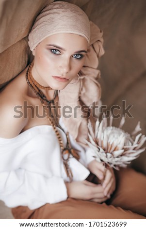 Stock Photo - Beautiful fashion model posing in boho style clothes