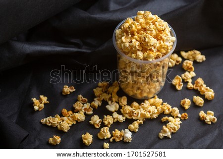 Popcorn in a large bucket.