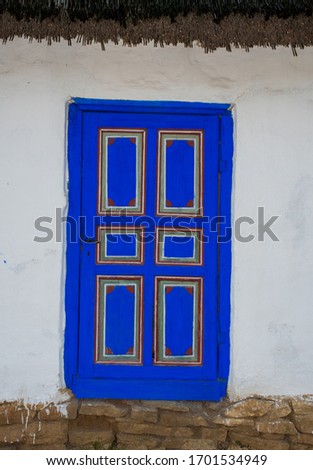 Traditional Romanian blue rural house door, specific to the buildings in Dobrogea area of the country.