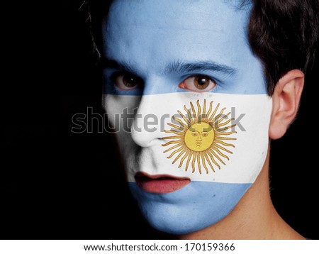 Flag of Argentina Painted on a Face of a Young Man