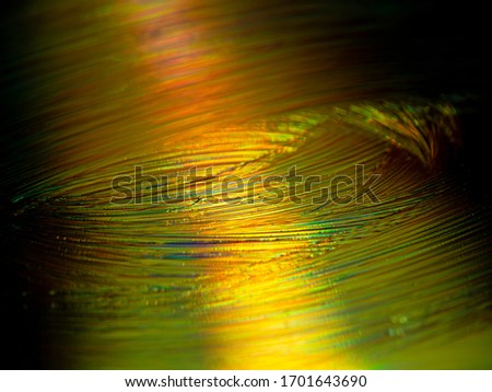 Horizontal abstract image of very gold and colored lines