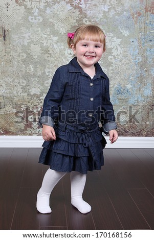 Beautiful Little Girl Posing for Camera in Studio