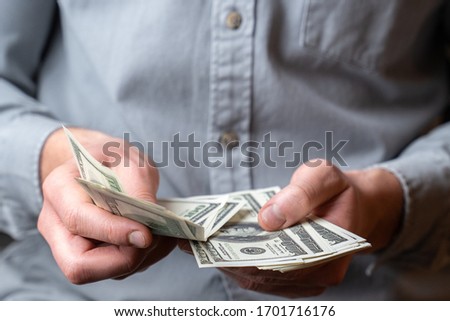 Adult man hands count money dollars Royalty-Free Stock Photo #1701716176