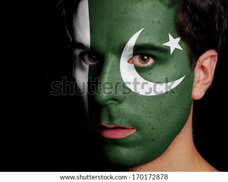Flag of Pakistan Painted on a Face of a Young Man