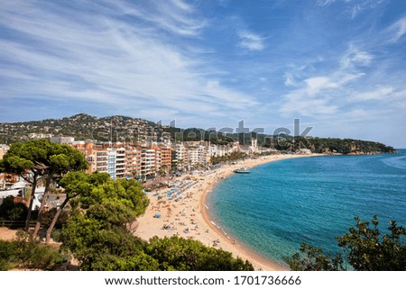 Vacation on Costa Brava in resort town of Lloret de Mar in Catalonia, Spain, beach, sea and town skyline, view from above.