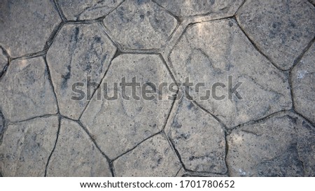 textured sidewalk made of rocks