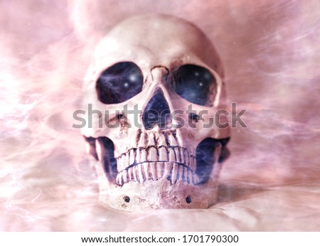 A skull with smoke around it. Smoking kills concept picture
