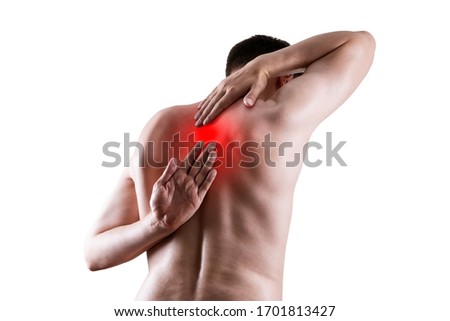 Pain between the shoulder blades, man suffering from backache isolated on white background, painful area highlighted in red Royalty-Free Stock Photo #1701813427