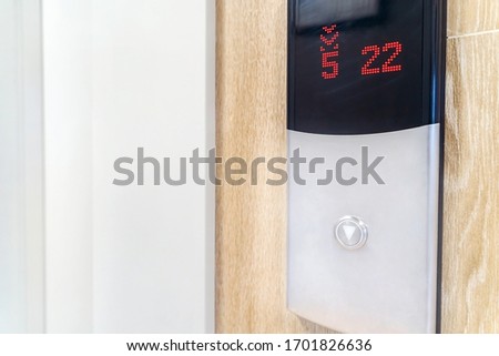 Button for calling the Elevator down in a modern home.