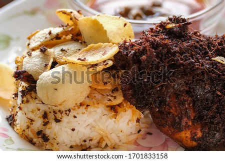 A close up picture of famous Malaysia dish call "nasi kukus" during lunch time.