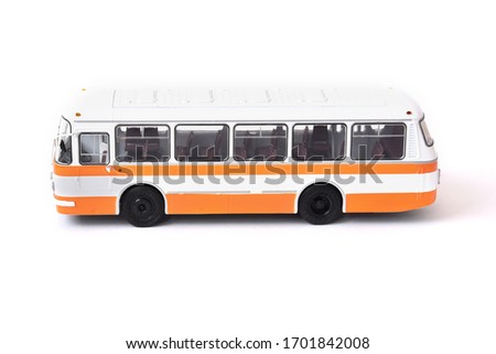 Scale model of a white yellow Russian bus. Toy yellow bus Royalty-Free Stock Photo #1701842008