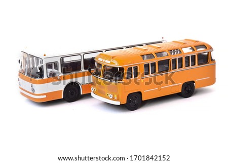 Scale model of a white and yellow Russian buses. Toy yellow bus Royalty-Free Stock Photo #1701842152