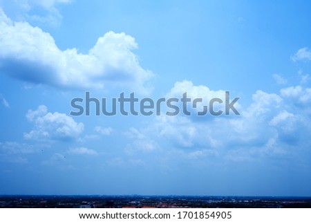 White clouds in the sky And large city and angle view