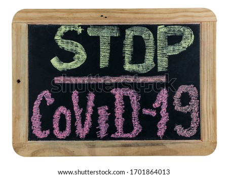 Chalk inscription stop coronavirus covid-19 on blackboard. World pandemic epidemic concept.
