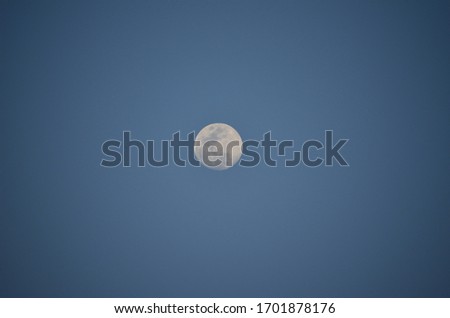Sunset on Dubai sand dunes with picture of moonlight