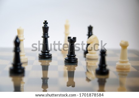 
chess figures on the glass board