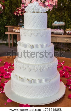 Wedding Setup. Cake table with decoration and flowers 