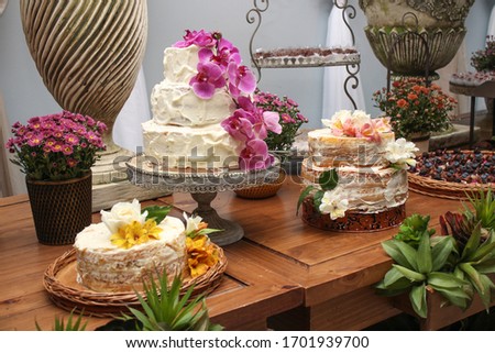 Wedding Setup. Cake table with sweet, decoration and flowers