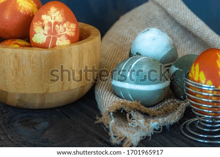 Traditional easter eggs on dark background and rustic cloth
