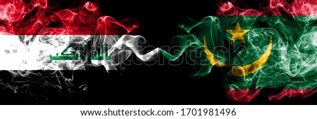 Iraq, Iraqi vs Mauritania, Mauritanian smoky mystic flags placed side by side. Thick colored silky smokes flags together