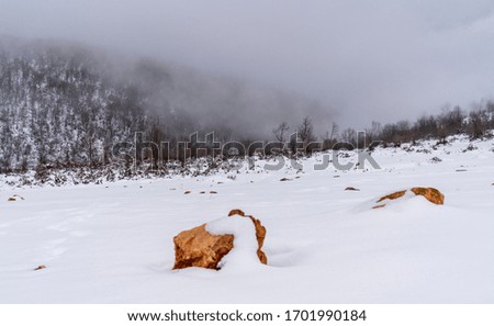 Mountain and clouds. winter landscape, snowflakes. March 18, 2020 Turkey