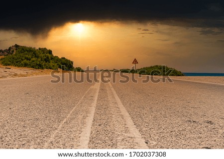A lonely road on the beautiful island of Rhodes, Greece at sunset