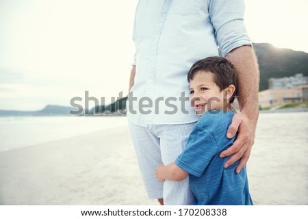 Feeling of safety and security, love hug from father and son at beach Royalty-Free Stock Photo #170208338