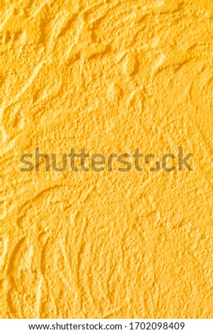 Yellow concrete wall texture. Luxury background for design on a building theme, decor theme. Handmade.
