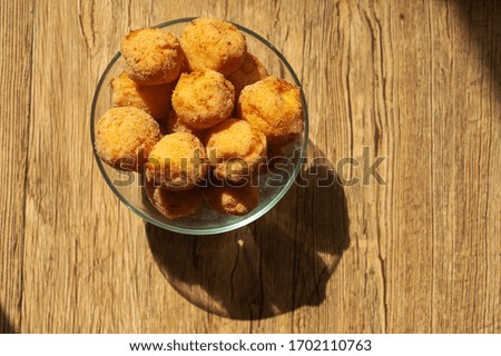art background photo of a plate with Russian donuts on a wooden background