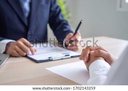 Businessmen layoffs in the company after 4 months of job evaluation. The management informed the reason for dismissal. The concept of a failed experiment Royalty-Free Stock Photo #1702143259