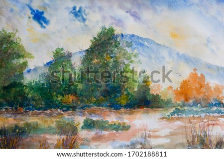 The colorful landscape is trees and mountain.