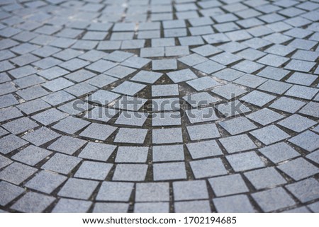 paving stone or tiles in patterns on floor with selective focus