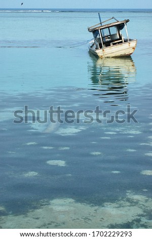Wooden boat at the sea