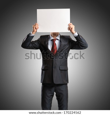 business man holding a poster, place for text