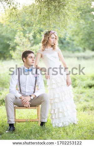 Beautiful wedding couple.Couple in a beautiful forest.Wedding ceremony in nature.Summer wedding of a beautiful couple. Beautiful couple at the wedding. Summer.Bride and groom. Laughter at ceremonia.