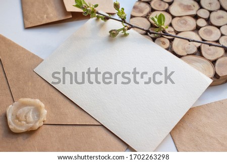card mochup with flowers envelope and wood. eco set. invitation card with  blooming branch