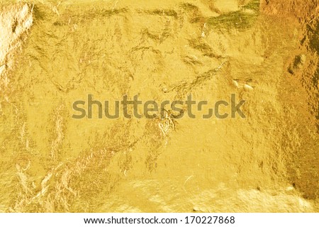 Shiny yellow gold foil abstract texture background Royalty-Free Stock Photo #170227868