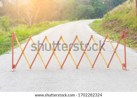 Steel barrier or traffic fence on road