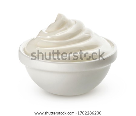 Swirl of sour cream in bowl isolated on white background with clipping path, fresh greek yogurt