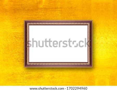 Gold picture frame isolated on a golden background Old village background design