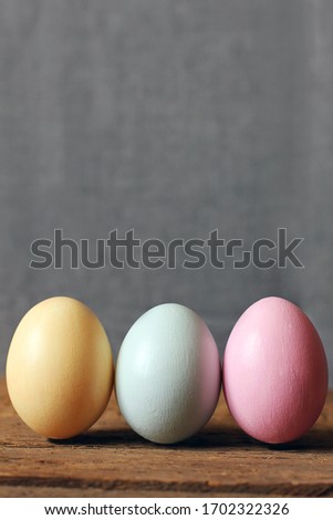 Eggs in a basket on a wooden background.
