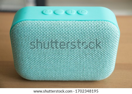 The turquoise  mini mobil speaker 