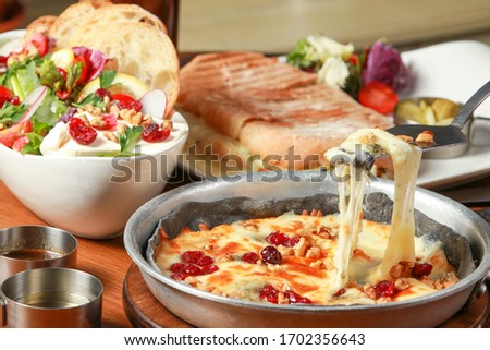 Italian foods with salad, pizza and panini. Royalty-Free Stock Photo #1702356643
