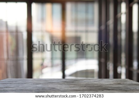 Empty space on pld wooden table can be used for display or mock up for display of product,Raindrops on window with blurred out background. - Image