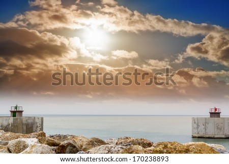 Entrance of harbor with beautiful sky.