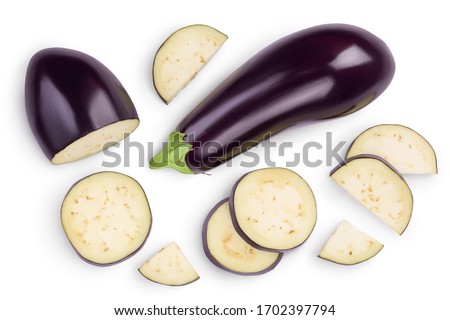 Eggplant or aubergine with slices isolated on white background. Clipping path and full depth of field. top, view, flat lay Royalty-Free Stock Photo #1702397794