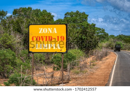 Road advertising safe zone sign from Coronavirus or Covid-19 pandemic outbreak, Safe area signage, No danger and no infection from virus. Military font. Spanish text "free area"